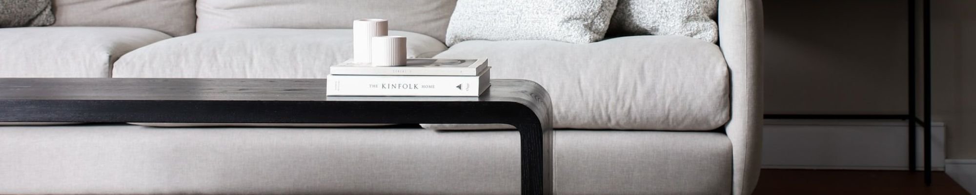 white couch and black coffee table on a brown hardwood floor from Leon Country Floors & More in Sparta, WI